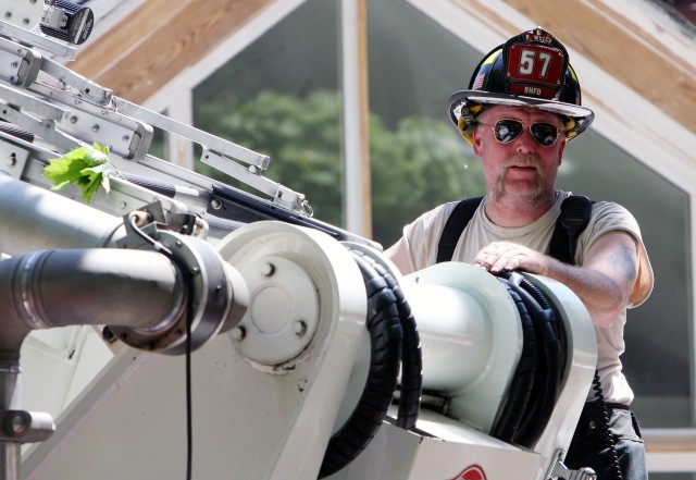 Pete Welch operates Tower Ladder 57 @ 77 Chestnut Ridge rd  Photo courtesy Frank Becerra